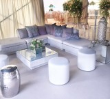 White 'Marrakesh' rattan sofas at Marquee Wedding